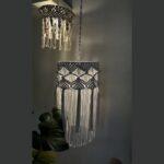 Elevate your space with our Handmade Macramé Hanging Lampshade. Crafted with meticulous attention to detail, this stunning piece adds a touch of bohemian elegance to any room. The intricate macramé knots create a beautiful texture that casts a soft and warm glow when the lamp is lit. Its versatile design allows it to be hung in various settings, whether it's in the living room, bedroom, or even on a covered patio. Each lampshade is carefully handmade, making it a unique and special addition to your home décor. Create a cozy and inviting ambiance with our Handmade Macramé Hanging Lampshade and let its artistic beauty shine.