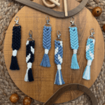 Add a whimsical touch to your keys with our Handmade Macramé Mermaid Tail Keychain. Crafted with care and attention to detail, this unique accessory showcases the artistry of macramé knots. The intricate design of the mermaid tail brings a sense of enchantment and fantasy to your everyday carry. Made with quality materials, this keychain is durable and built to last. Whether you use it to accessorize your keys, bags, or backpacks, the Handmade Macramé Mermaid Tail Keychain is sure to make a statement and capture the hearts of mermaid lovers everywhere. Dive into the magic of this charming keychain and let it accompany you on your daily adventures.